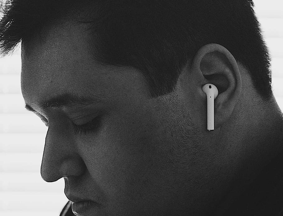 Person Using AirPods with an Android